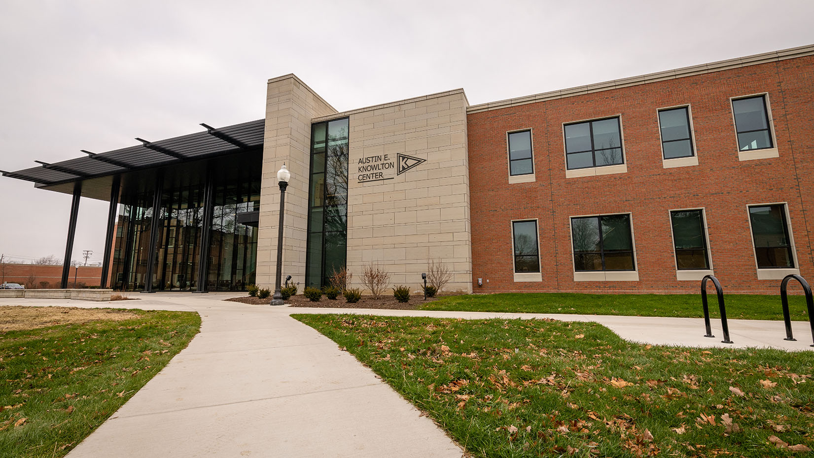 a sidewalk leading to the front entrance of the knowlton center