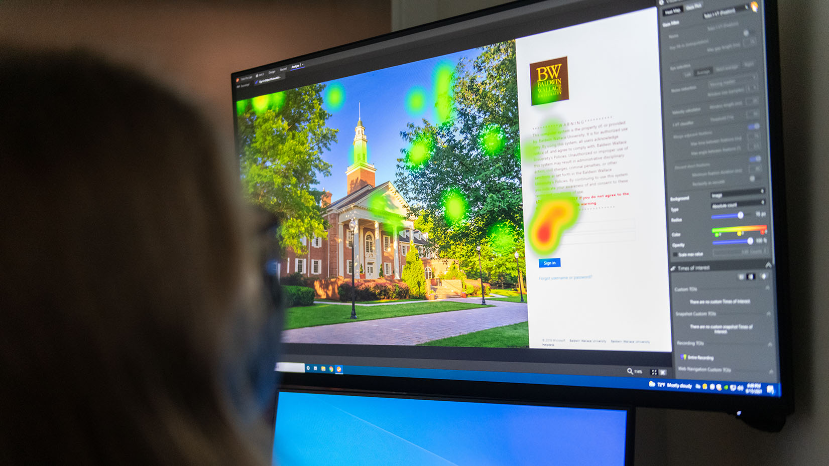 a person looking at a screen using heatmap technology